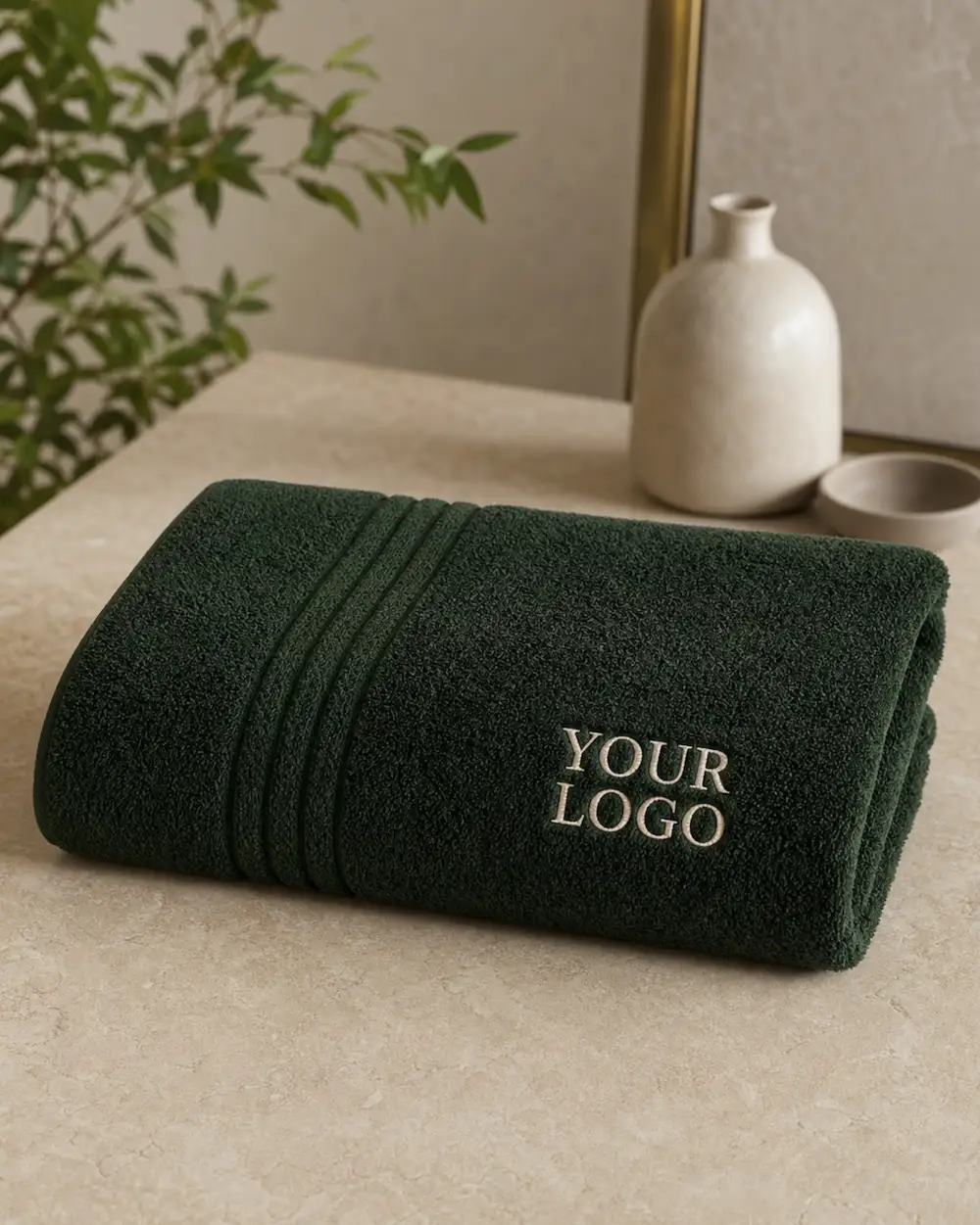 Dark green promotional towel with embroidered logo, ideal for corporate gifts, gyms and branded merchandise.