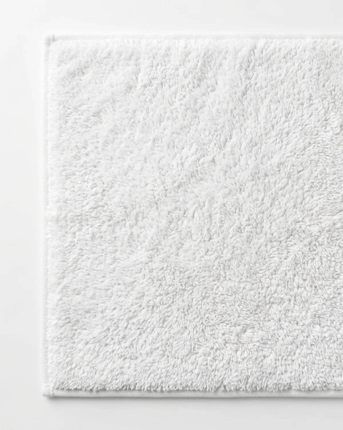 White cotton non slip bathroom mat for elderly with soft textured surface