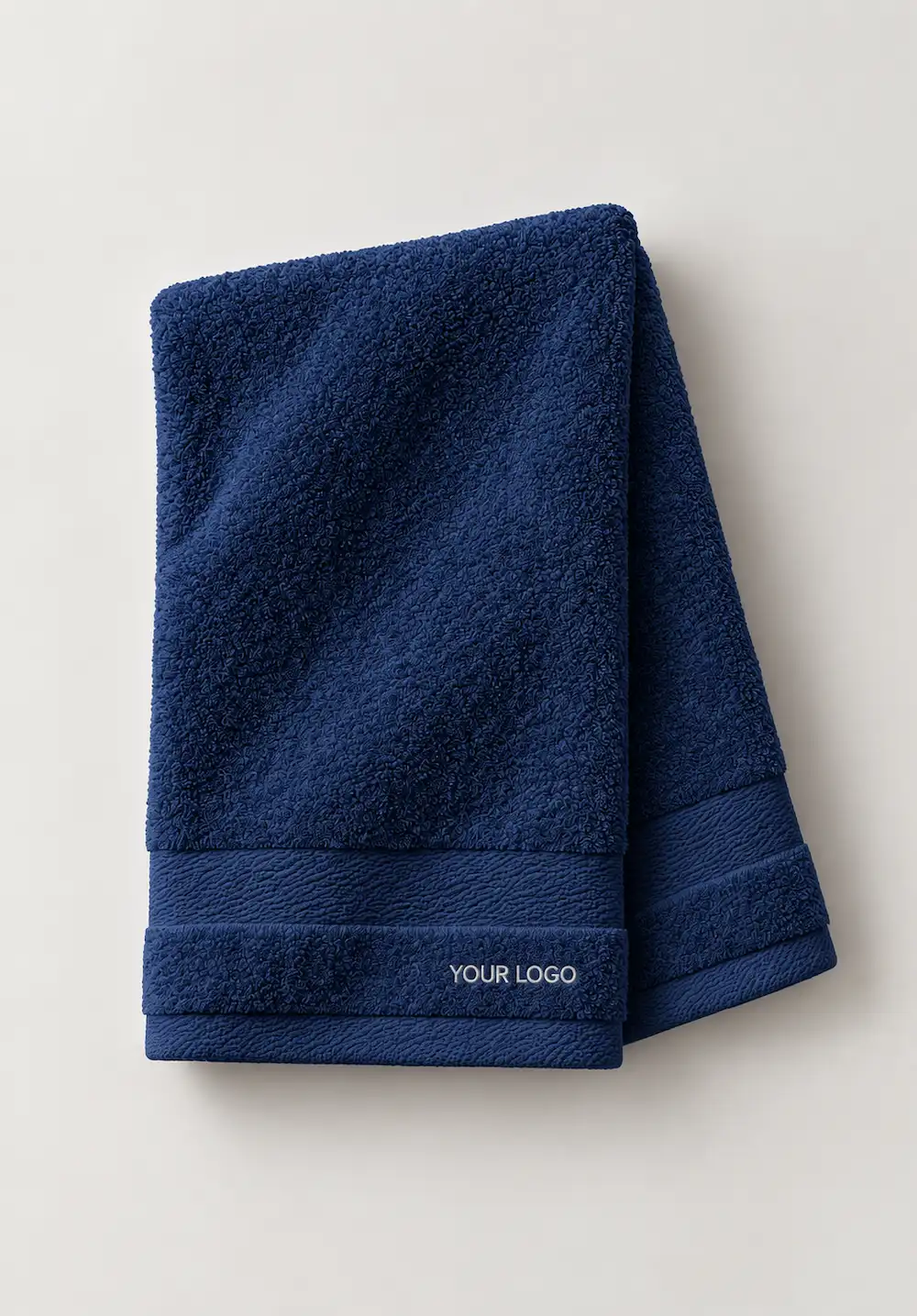 Navy blue textured hand towel with custom logo embroidery.