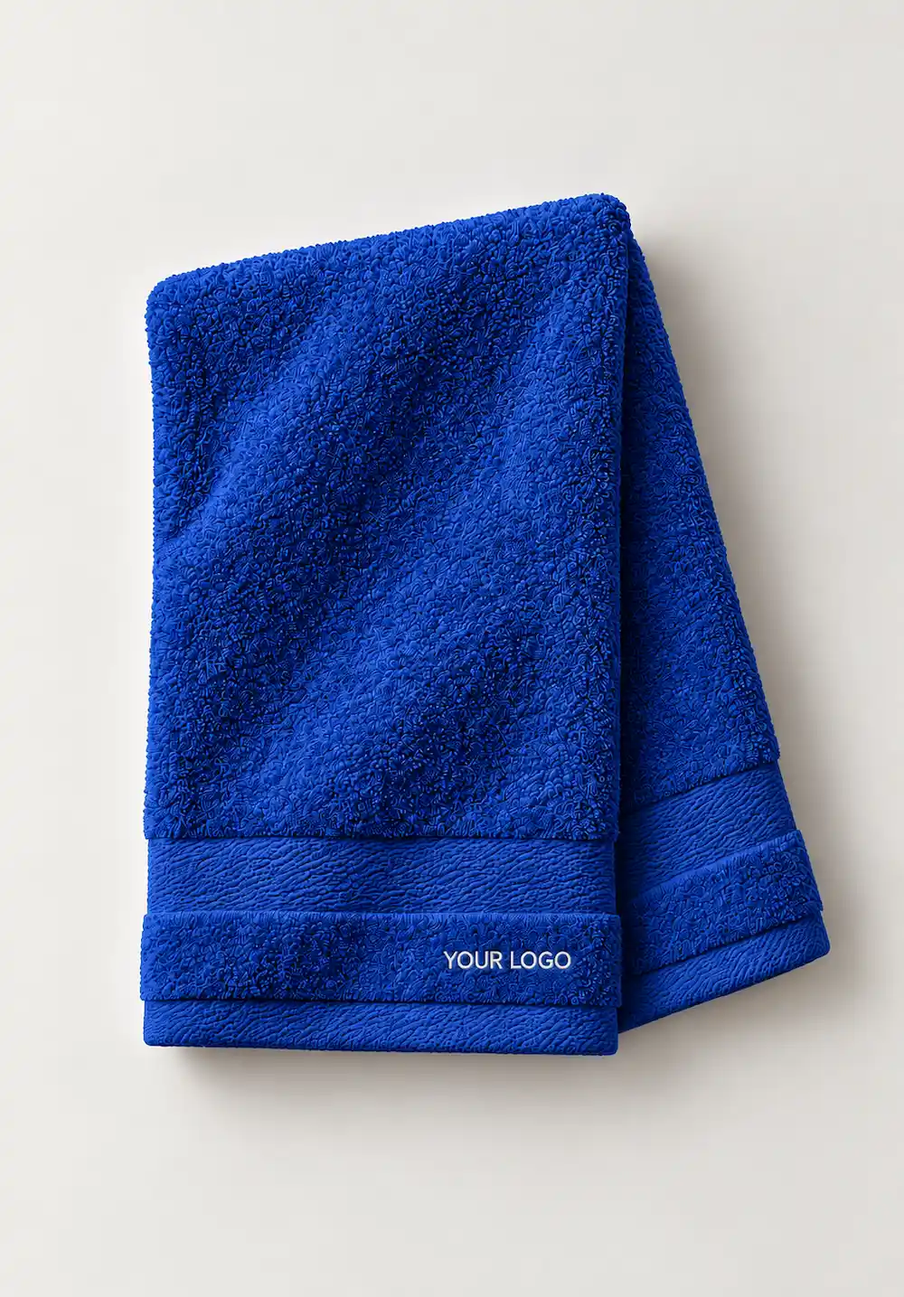 Royal blue textured hand towel with custom logo embroidery.