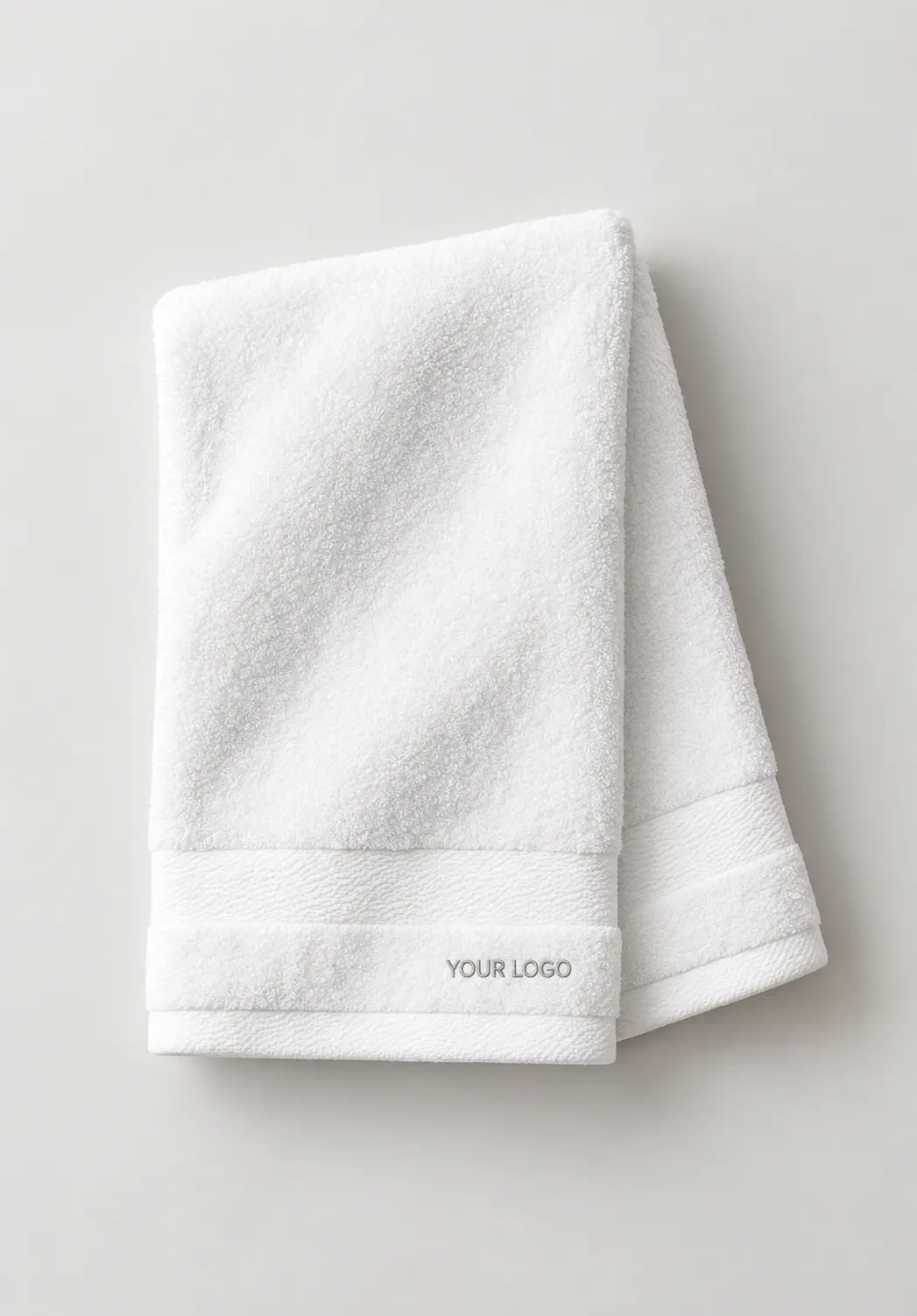 White hand towels with custom logo embroidery for bulk orders.